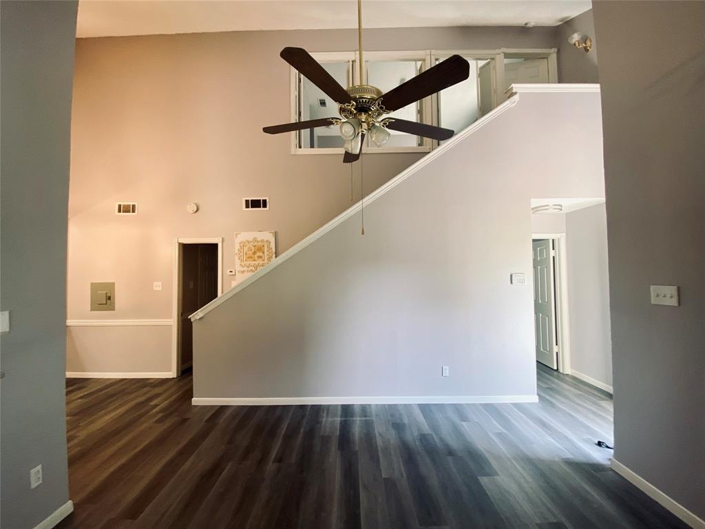 a view of a livingroom with wooden floor