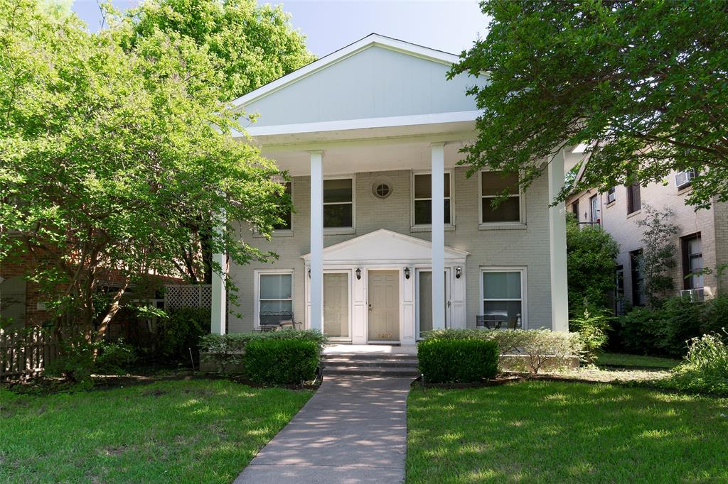 a front view of a house with a yard and porch