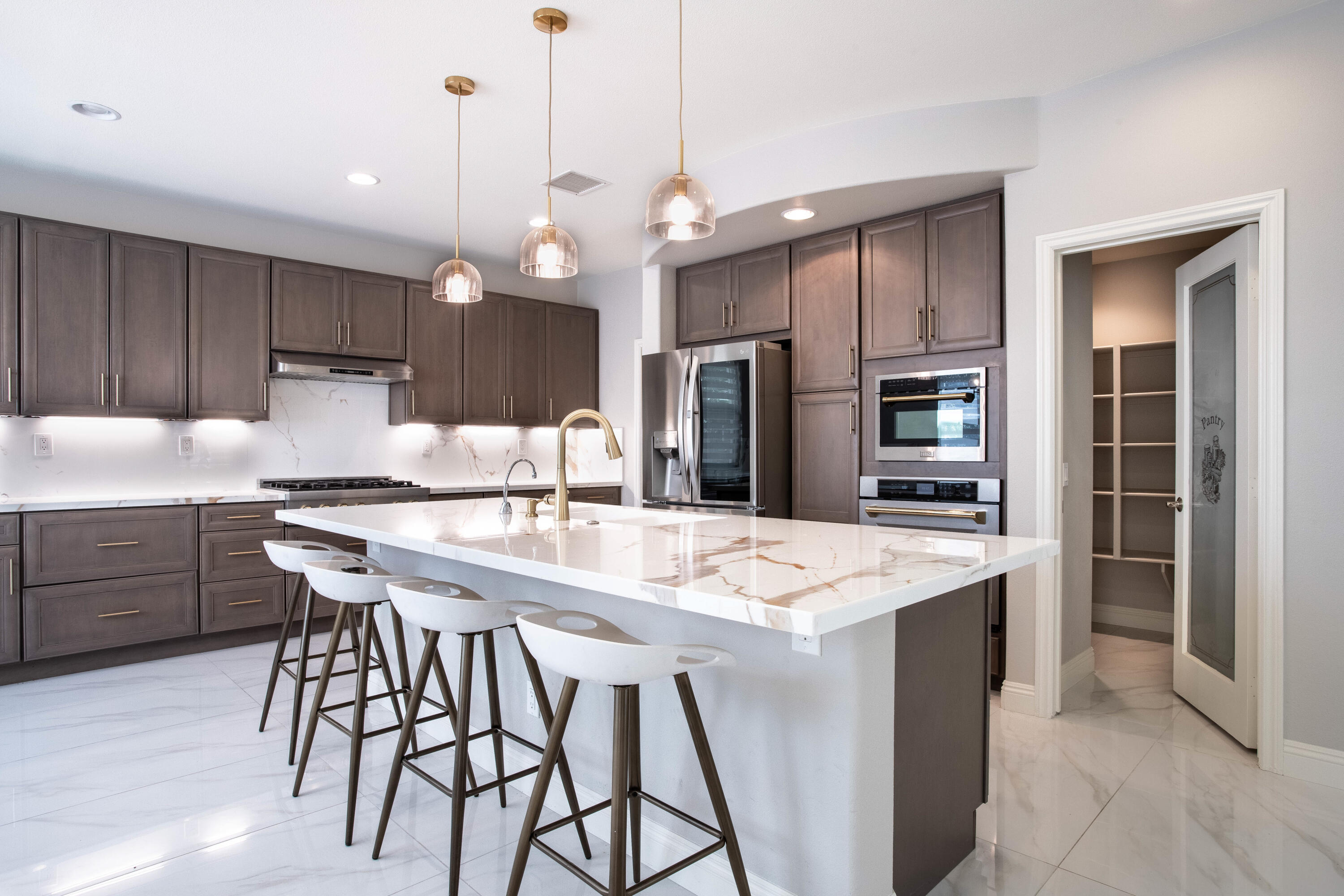 a kitchen with a center island and appliances