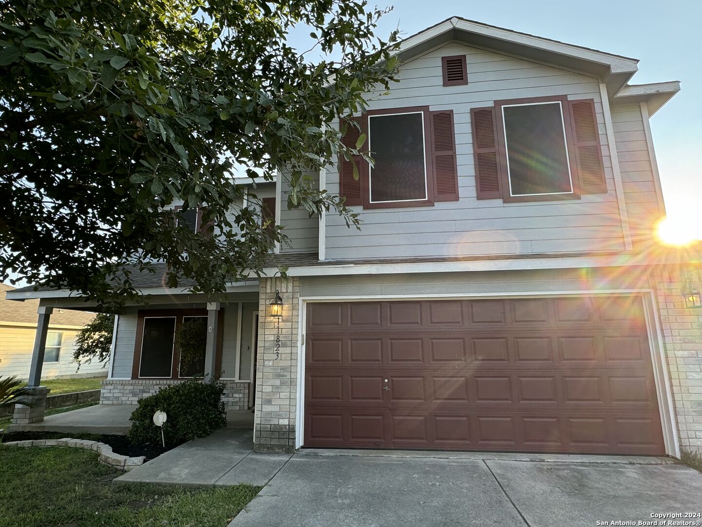 a front view of a house with a yard