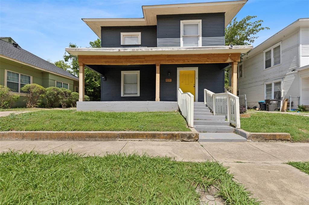 a view of a house with a yard and plants