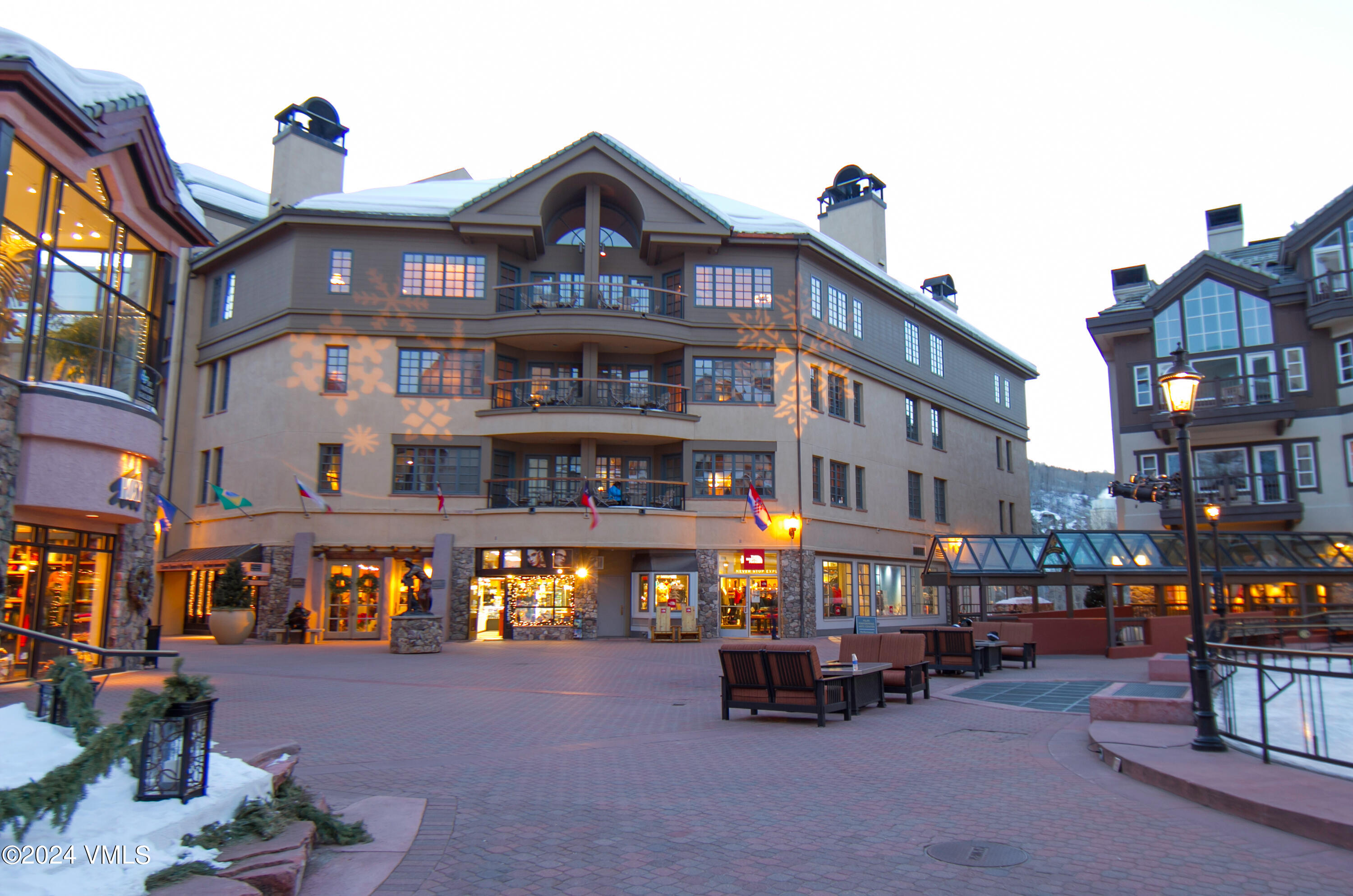 a view of a building with sitting area