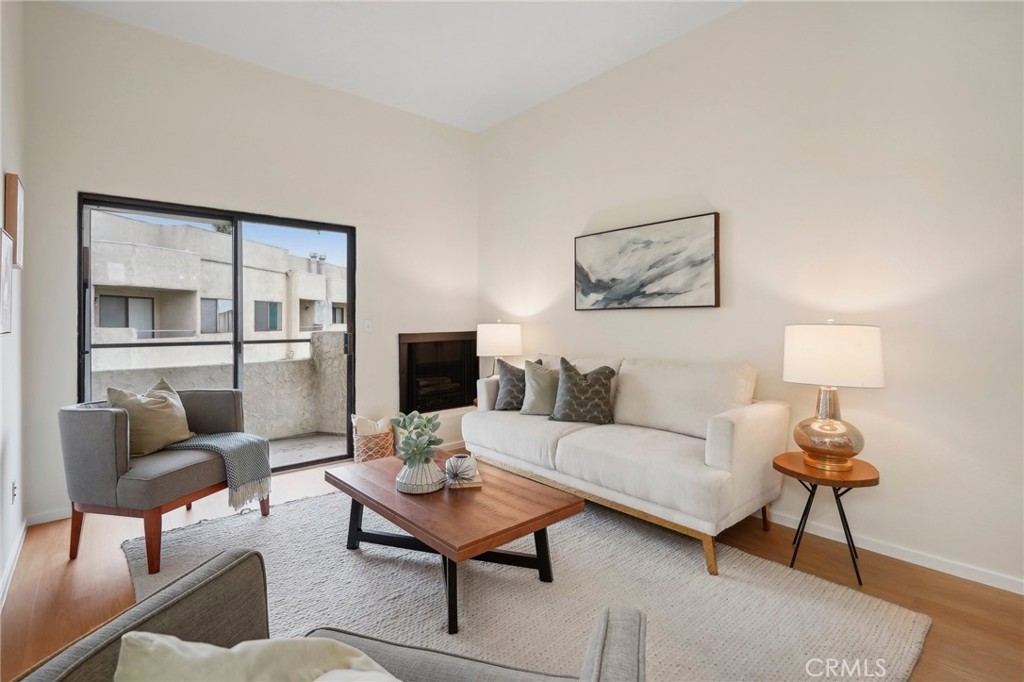 a living room with furniture and a lamp