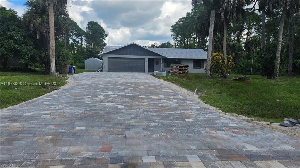 a front view of a house with yard