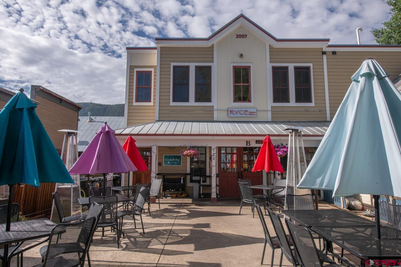 a view of a cafe with sitting area