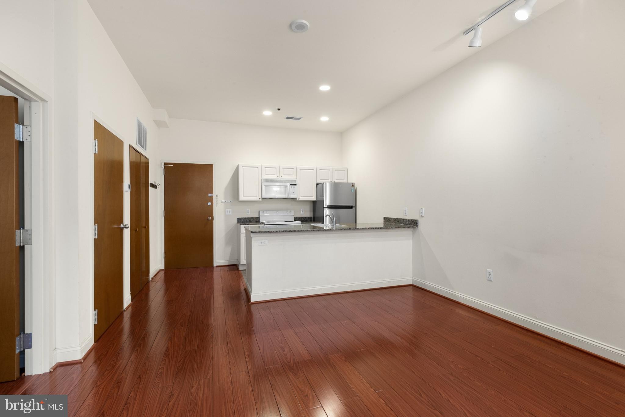 a view of kitchen with stainless steel appliances refrigerator oven and stove