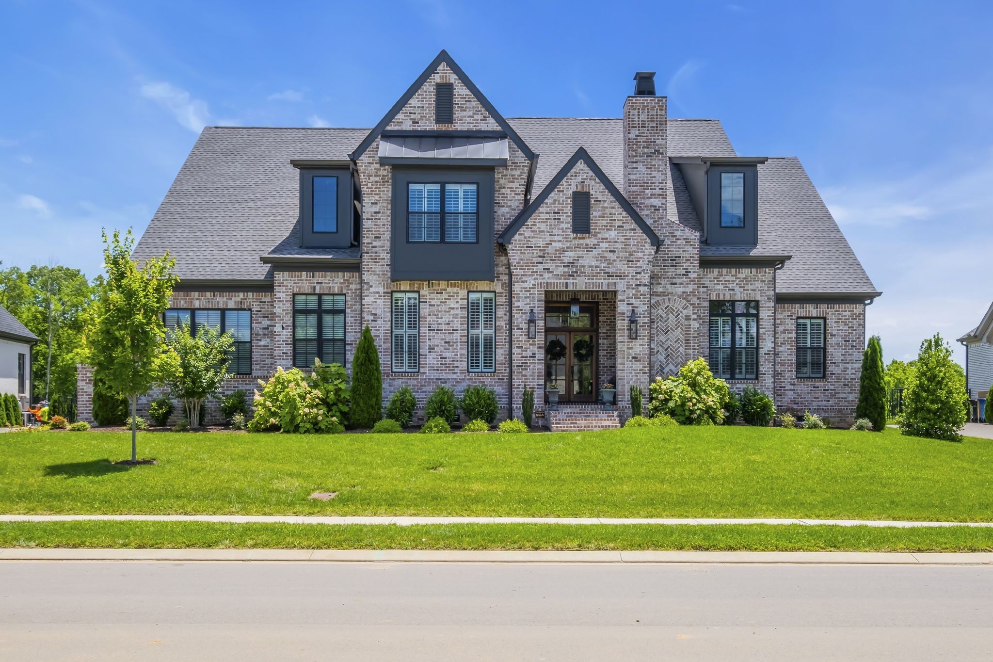 a front view of a house with a yard