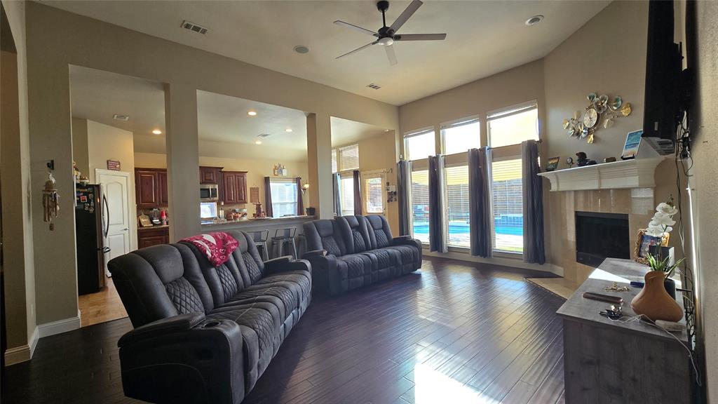 a living room with furniture fireplace and flat screen tv