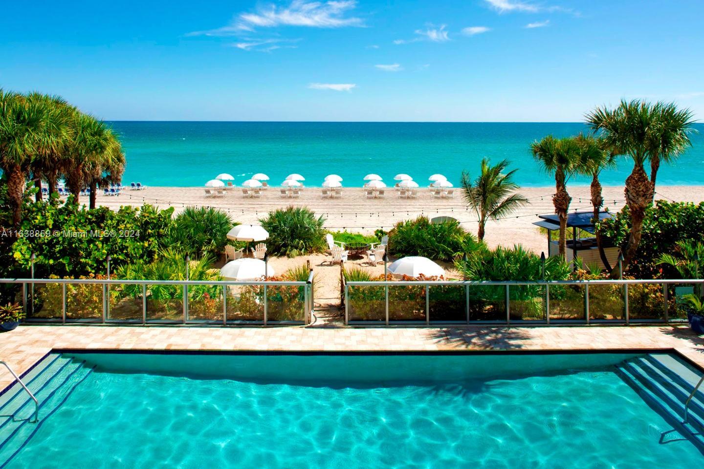 a view of a swimming pool with a garden