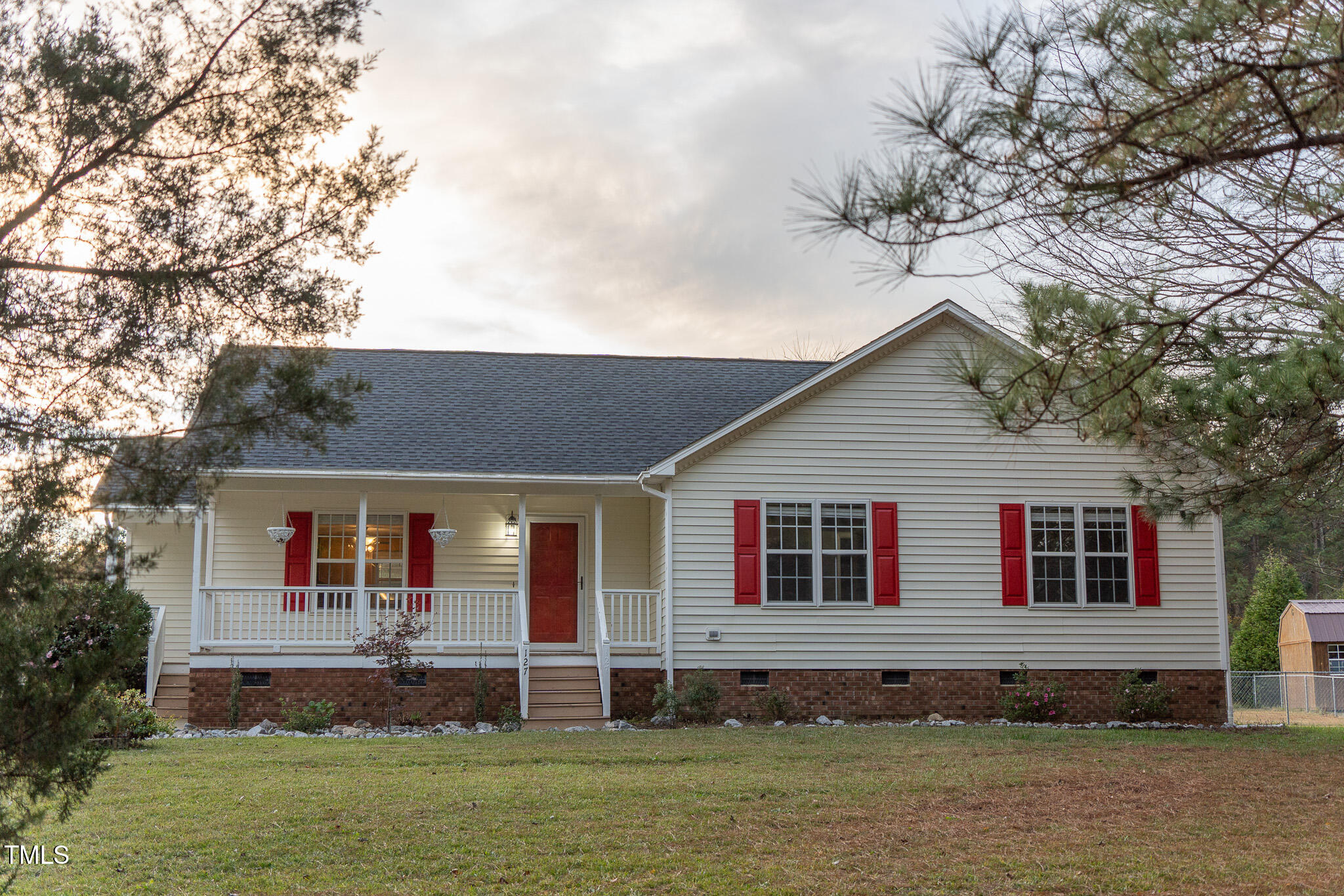 a view of house with a yard