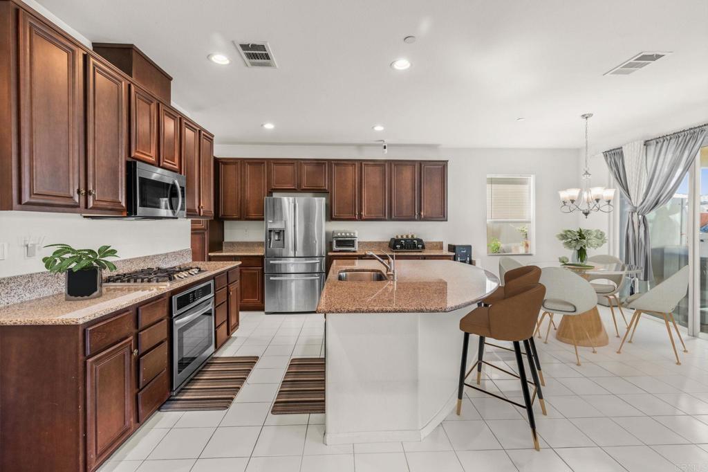 a large kitchen with lots of counter space and a sink