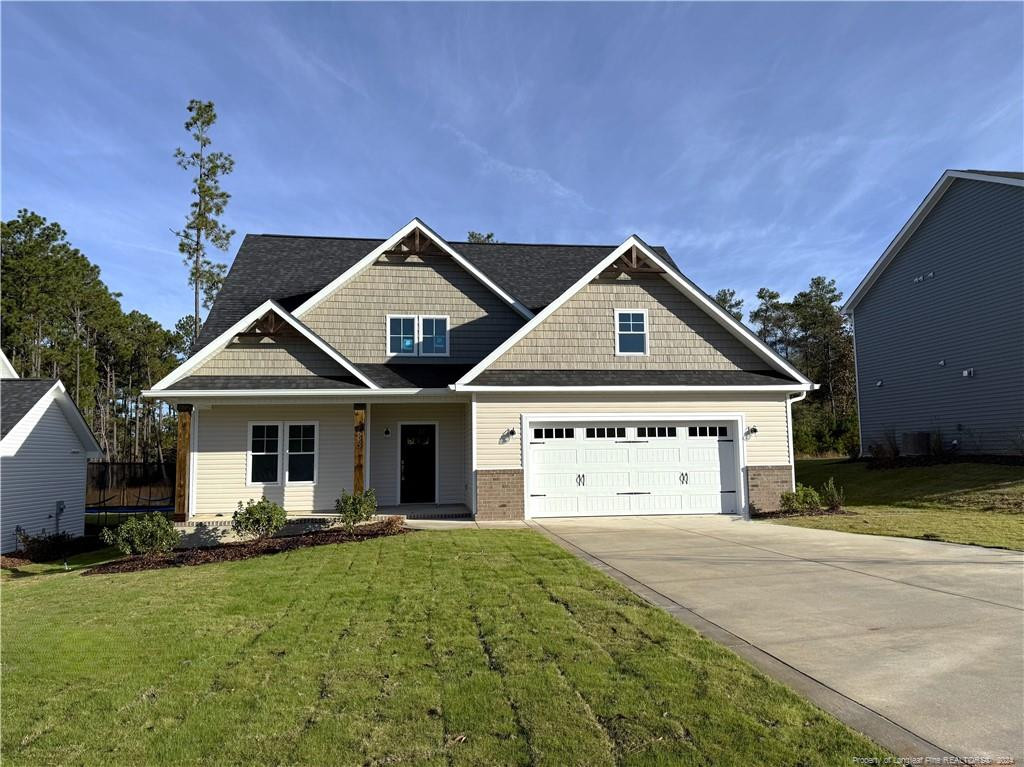 a front view of a house with yard