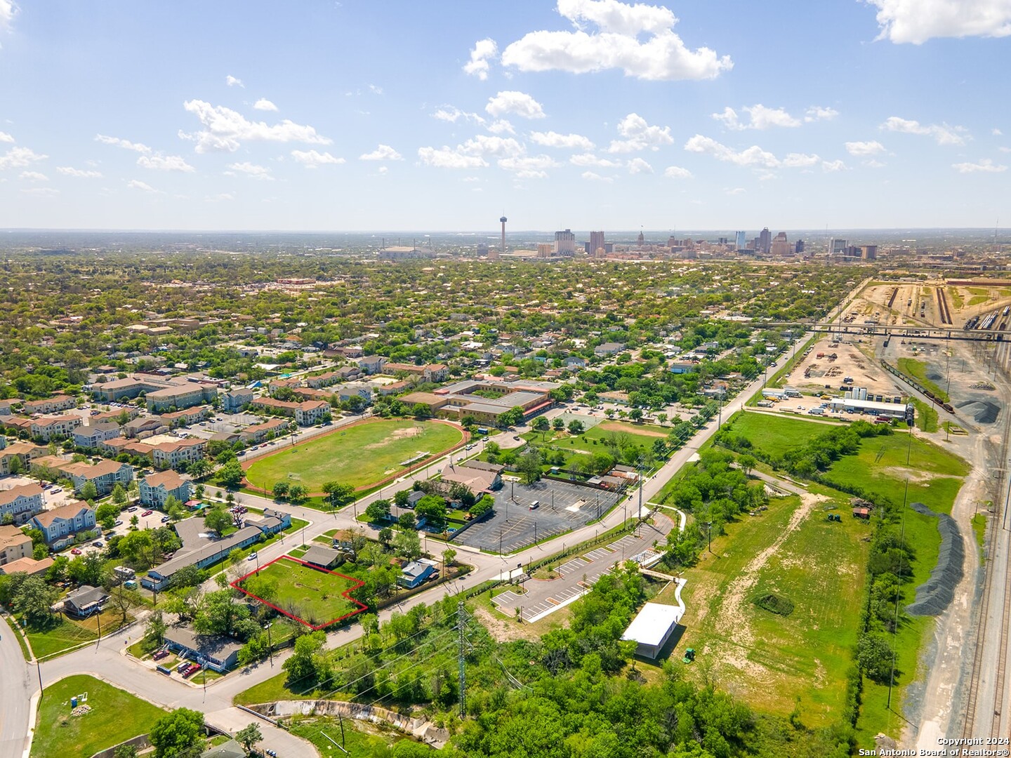 an aerial view of residential building and lake