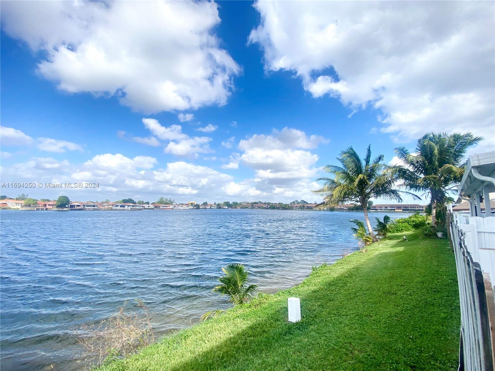 a view of a lake with a big yard