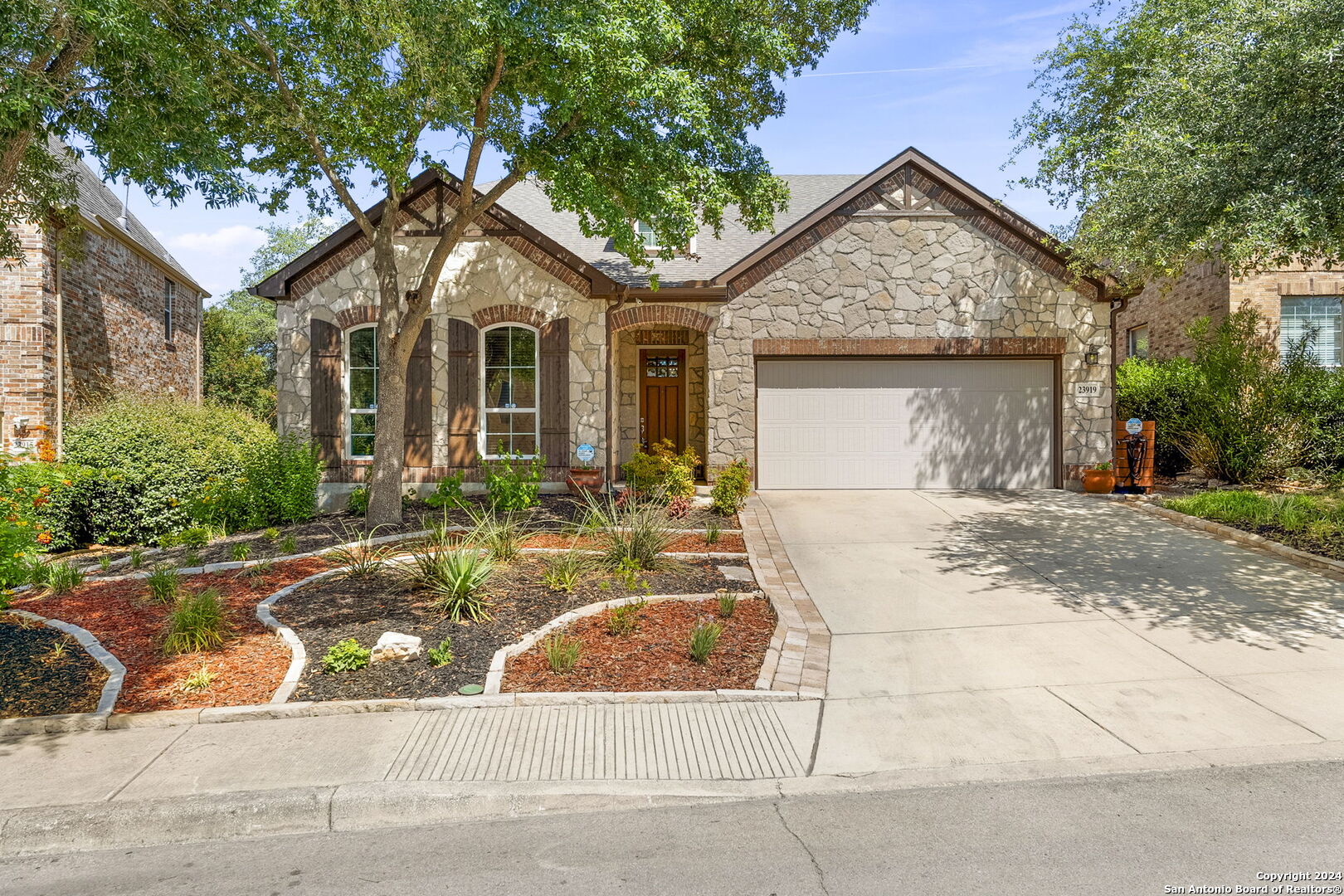 a front view of a house with garden