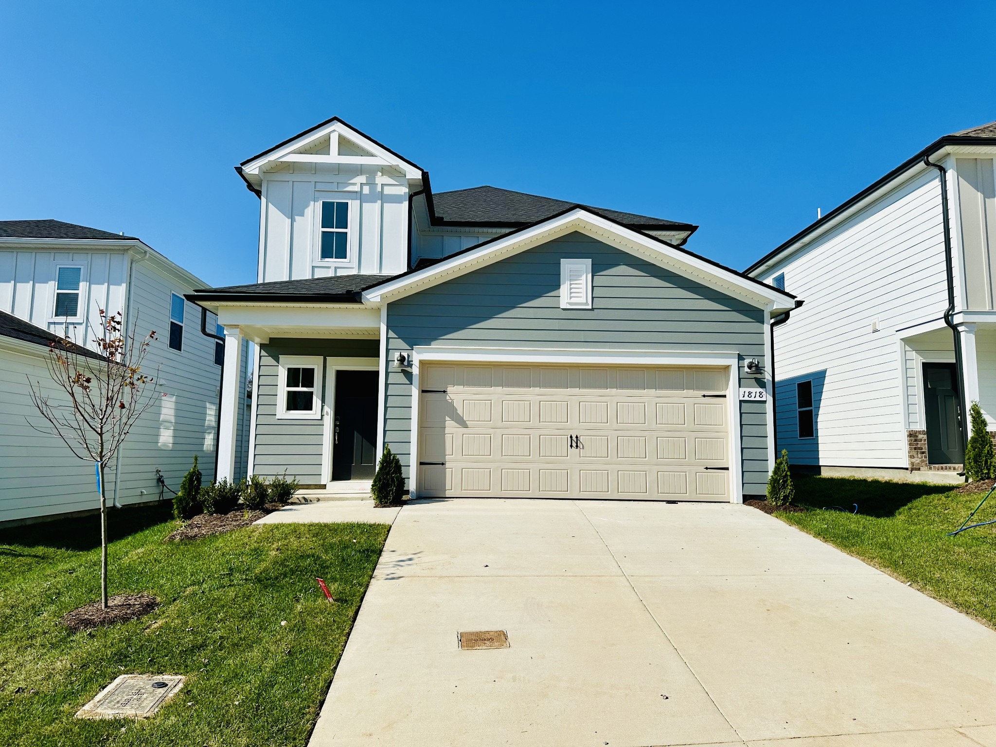 a front view of a house with a garden