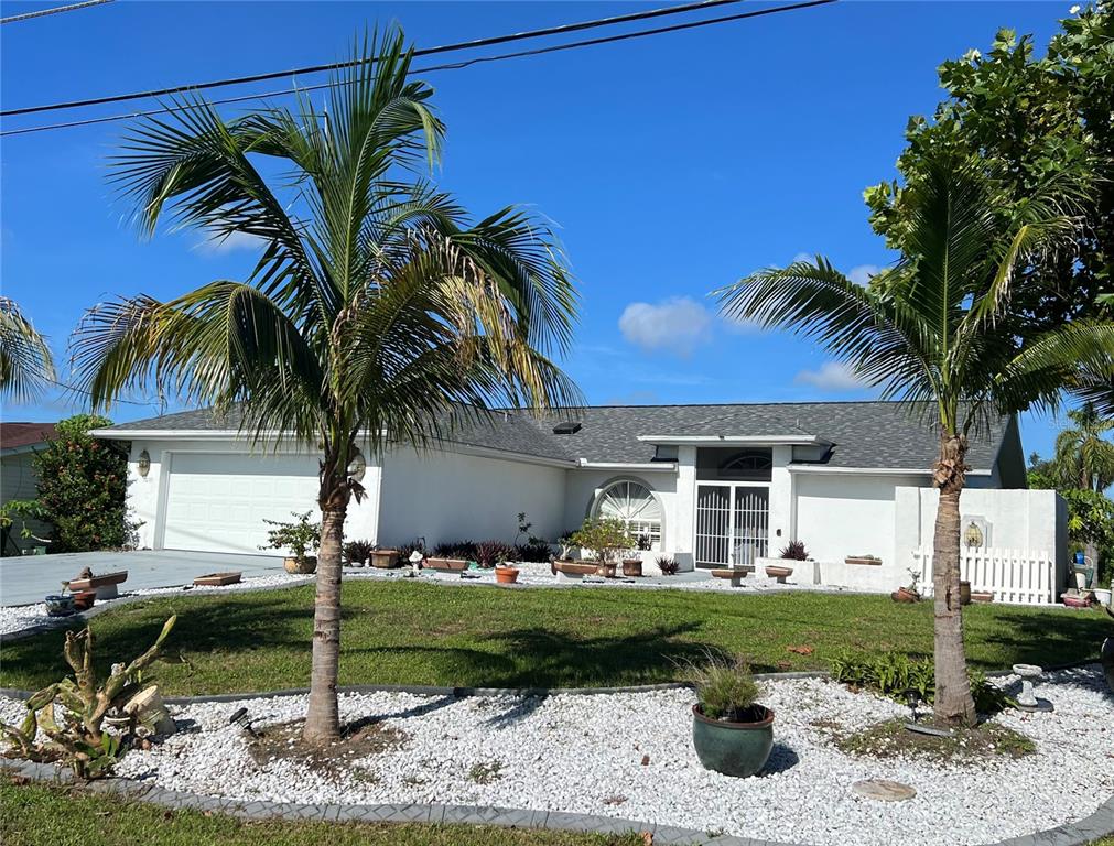 a front view of a house with garden and porch