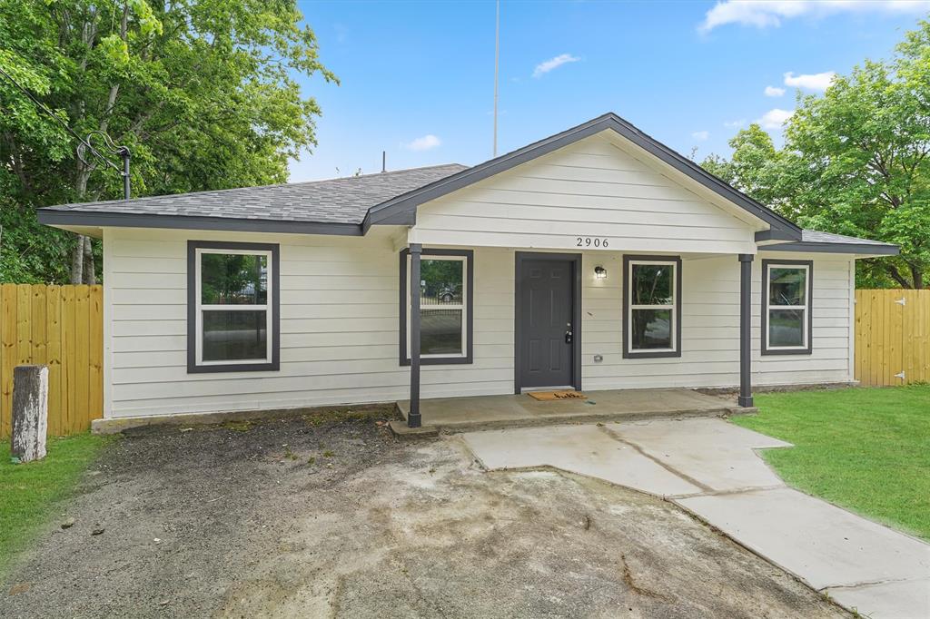 a front view of a house with yard