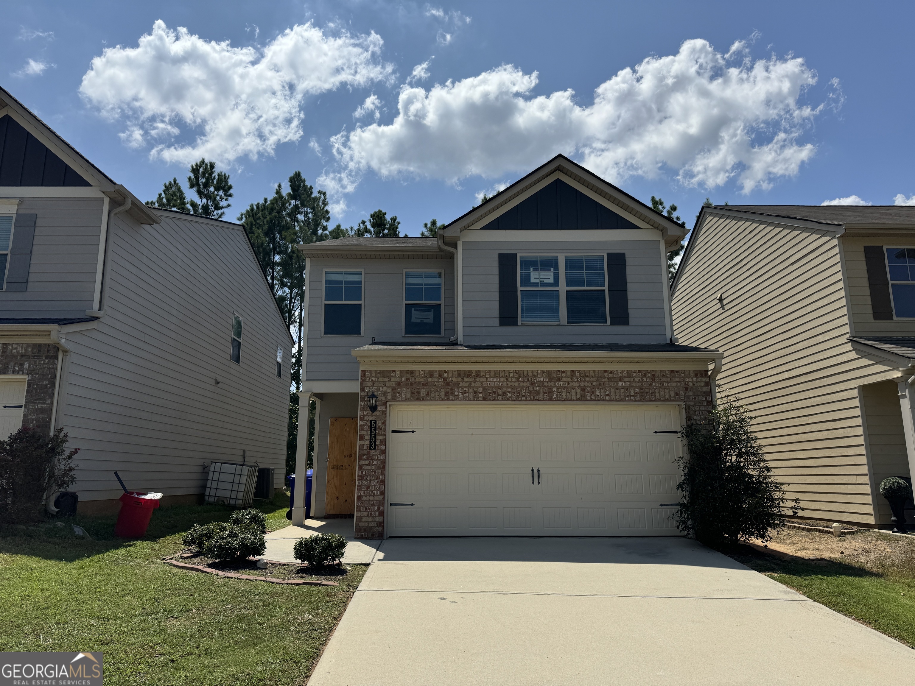 a front view of a house with yard