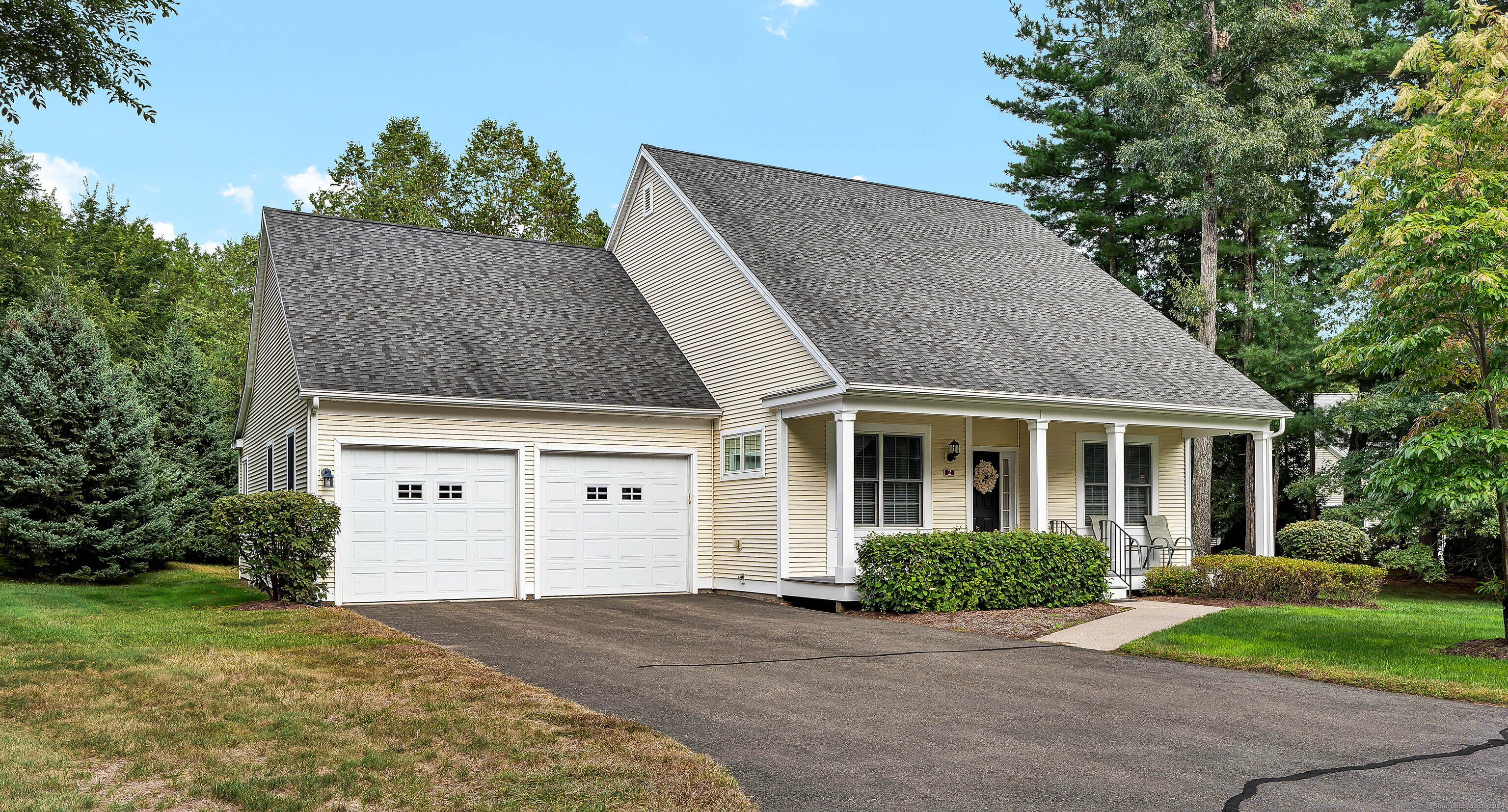 front view of a house with a yard