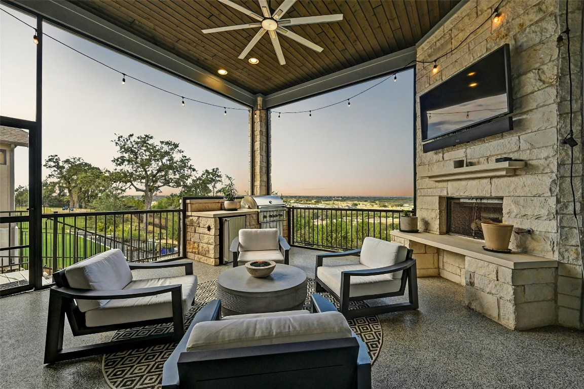 a balcony with furniture and a potted plant