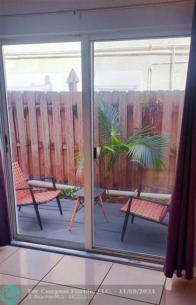 a view of two chairs in the balcony