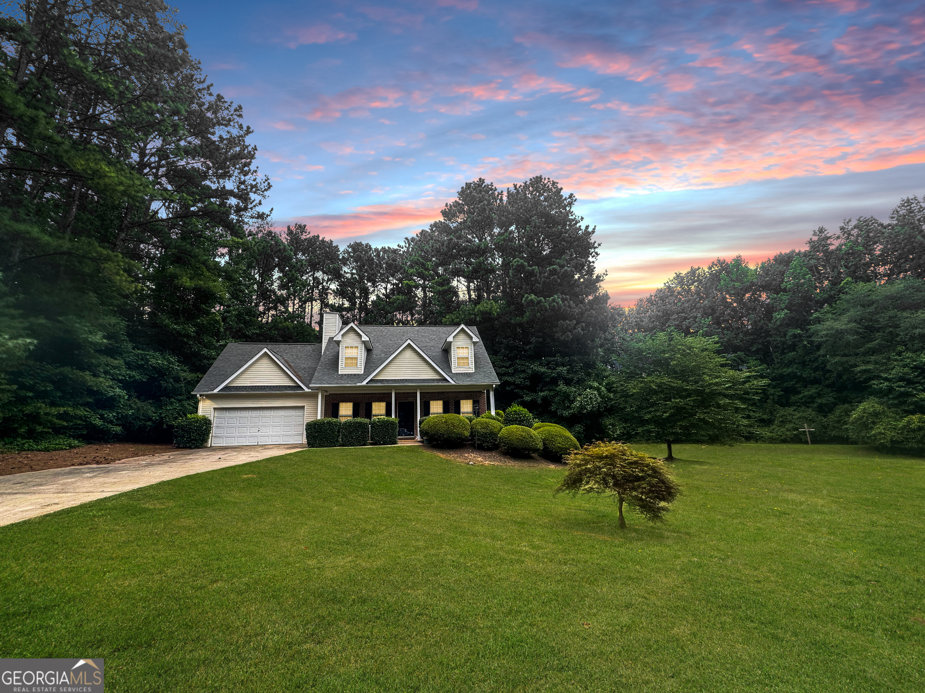 a view of a house with a yard porch and sitting area