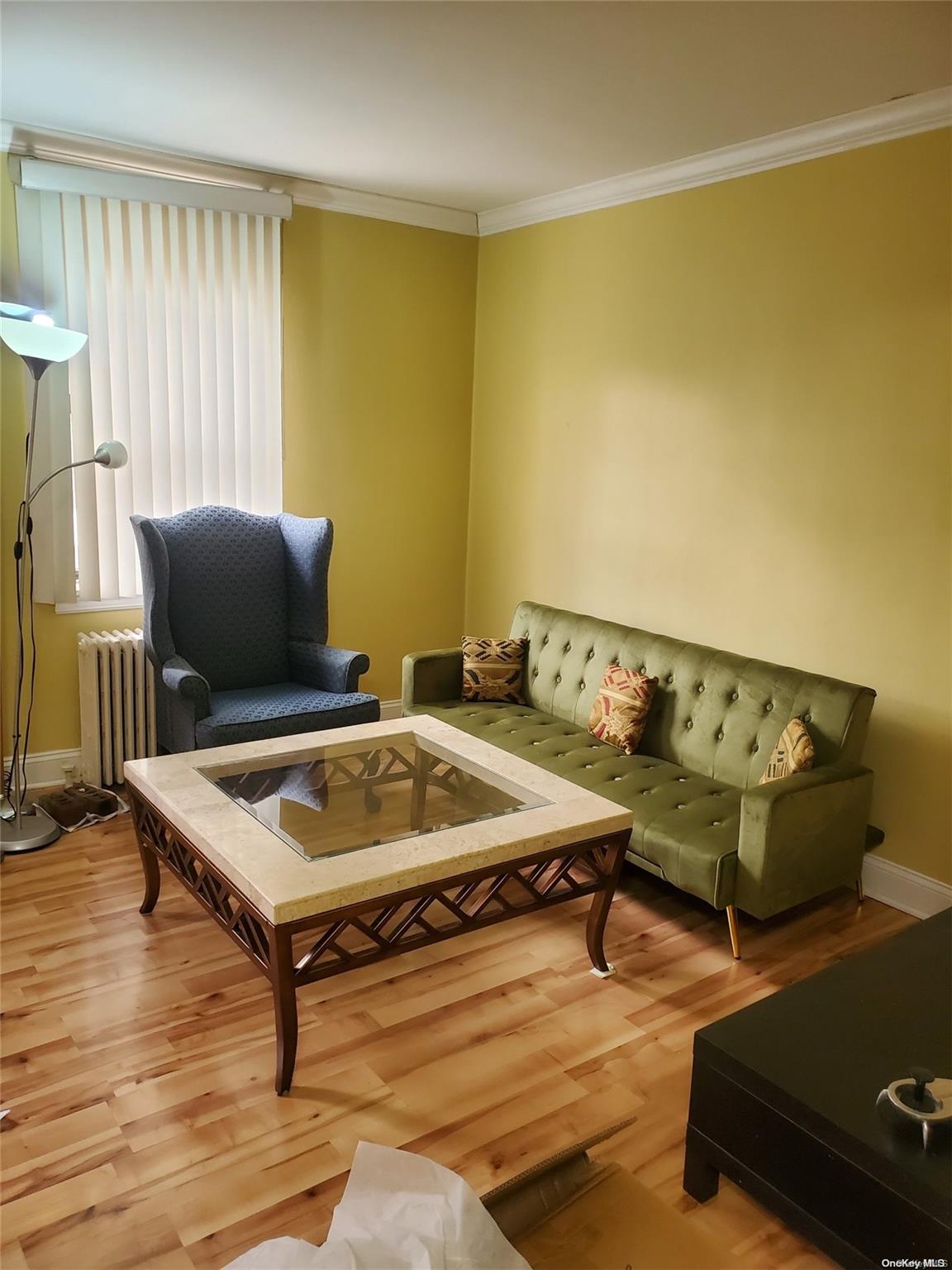 a living room with a table and a window