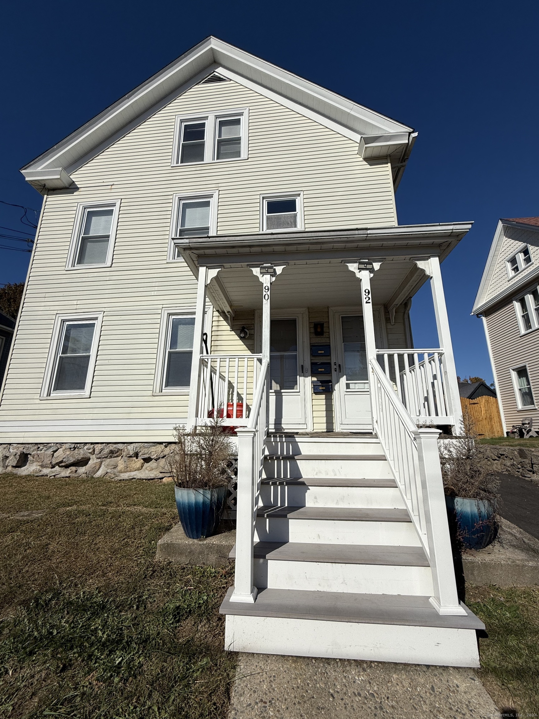 a front view of a house with a porch