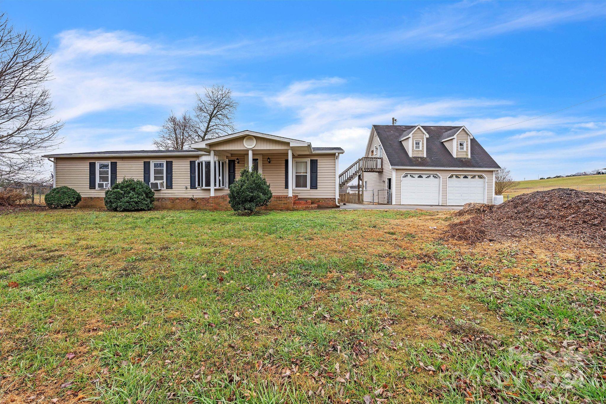 front view of a house with a yard