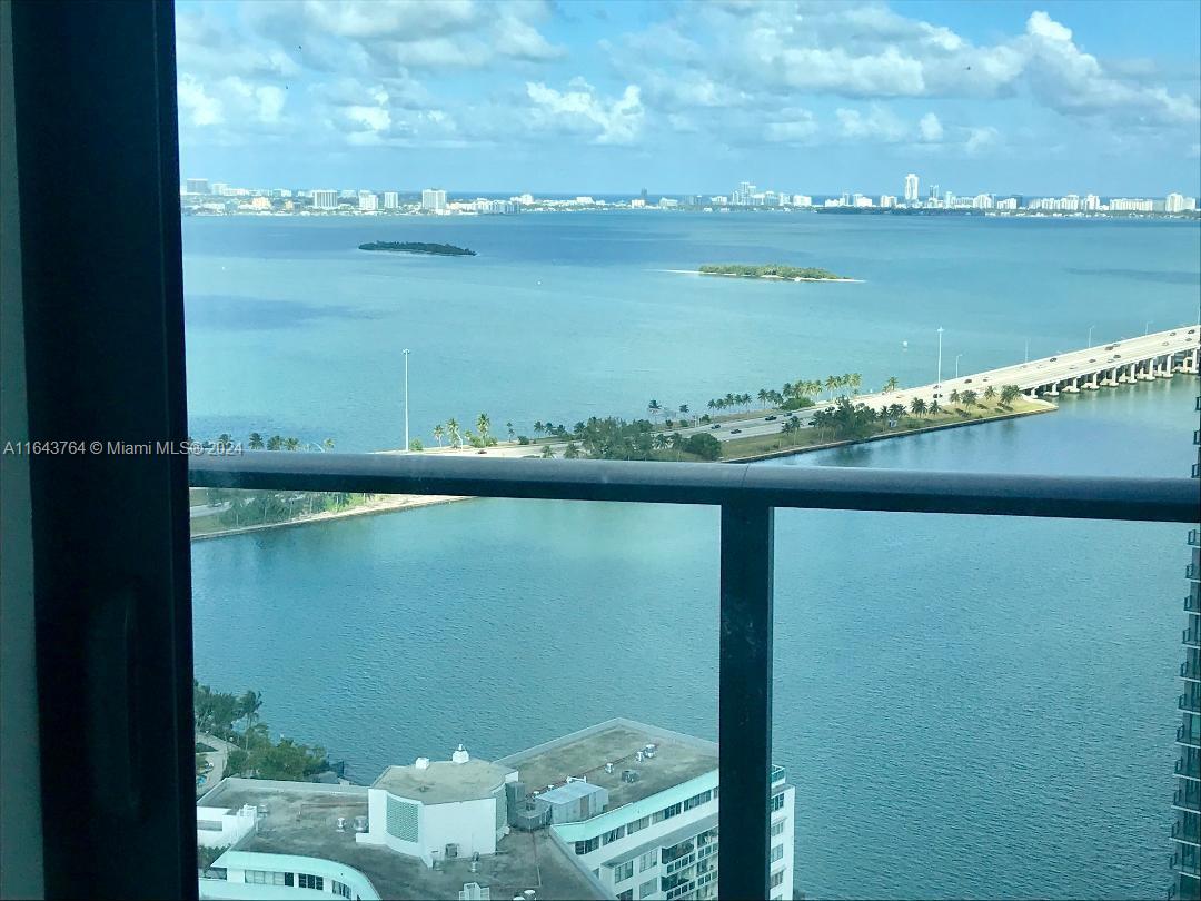 a view of a lake from a balcony