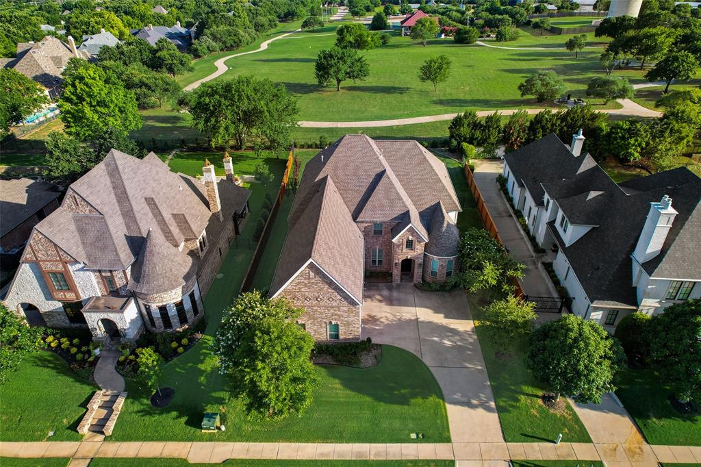 an aerial view of a house with outdoor space and street view