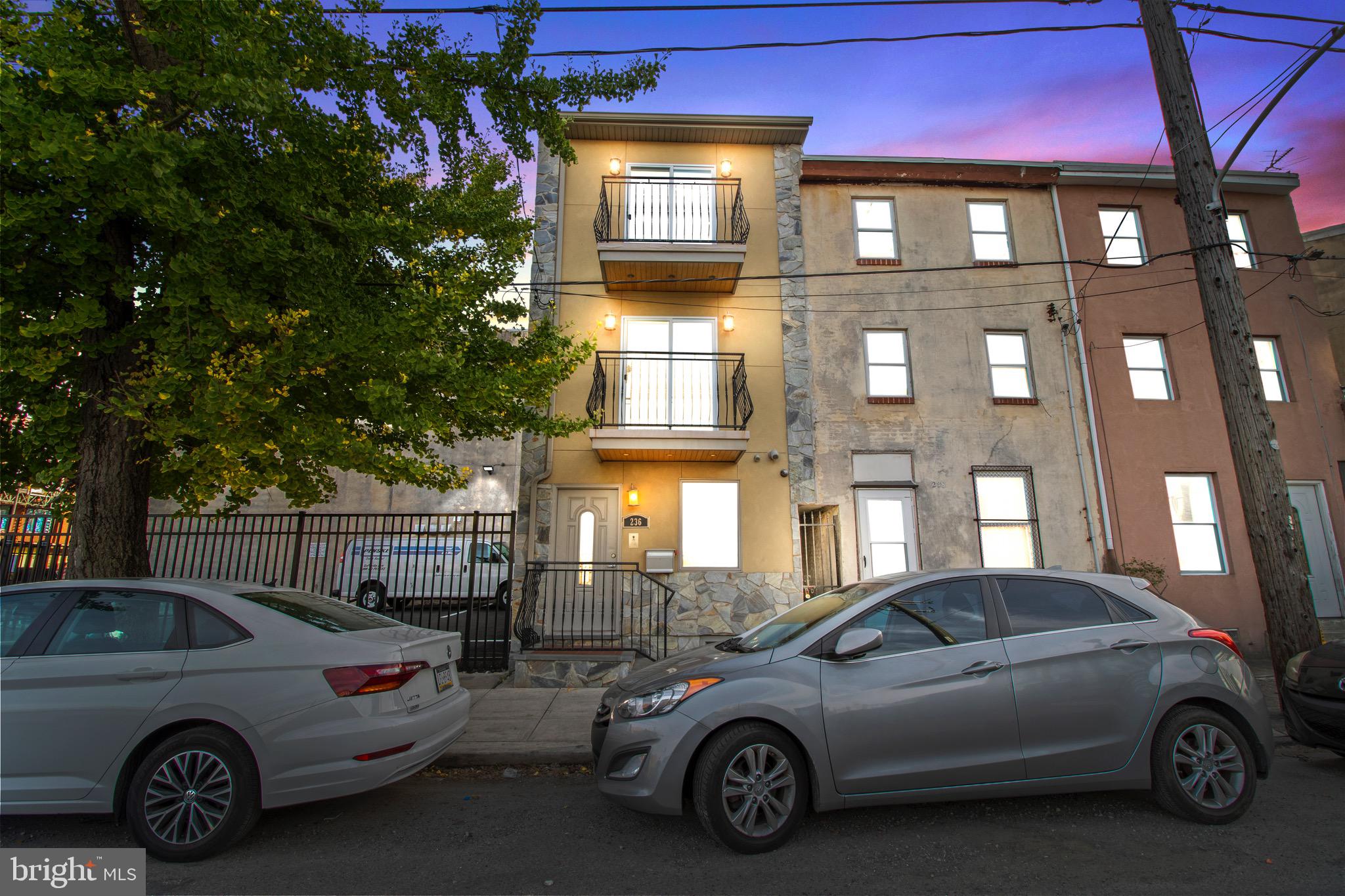 a view of a car parked in front of a building