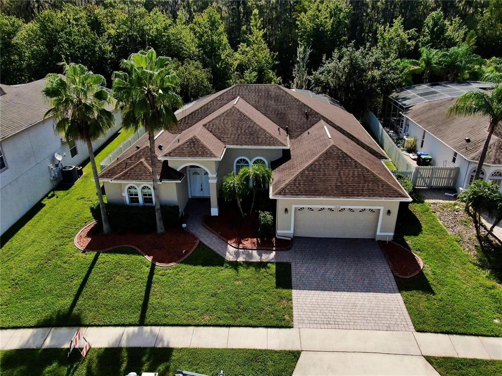 a aerial view of a house with a yard