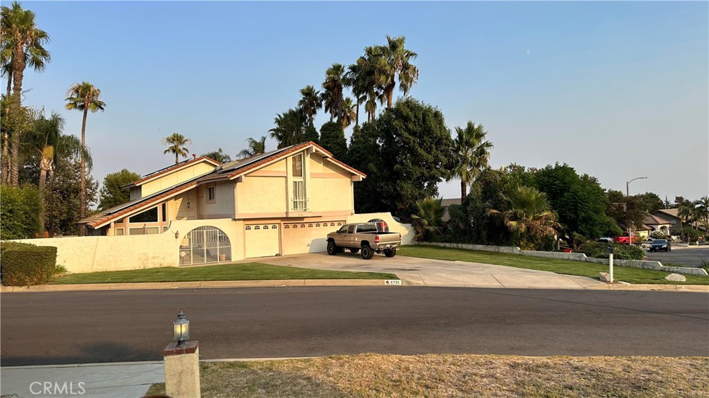 a view of a house with a street