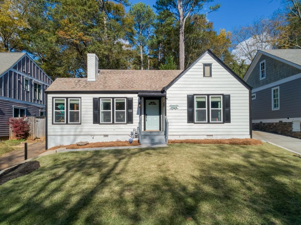 a house that has a big yard in front of it