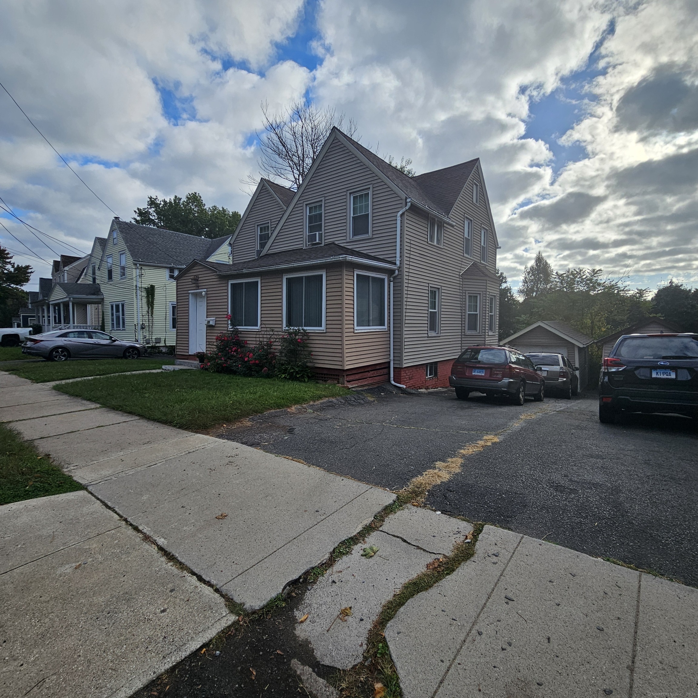 a car parked in front of a house