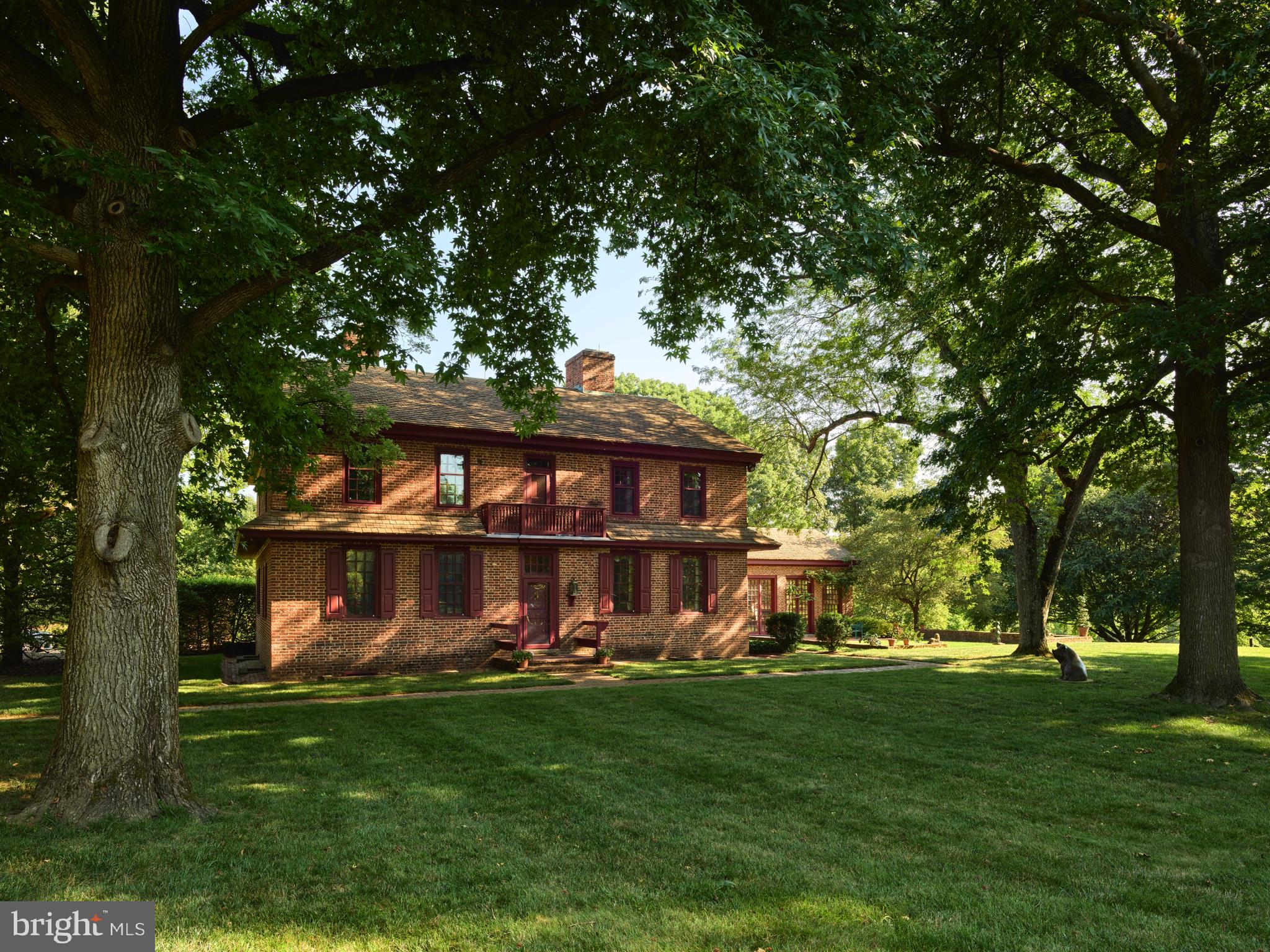 a view of a wooden house with a big yard