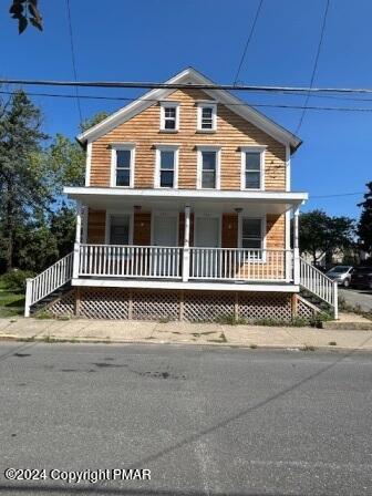 a front view of a house with a fence