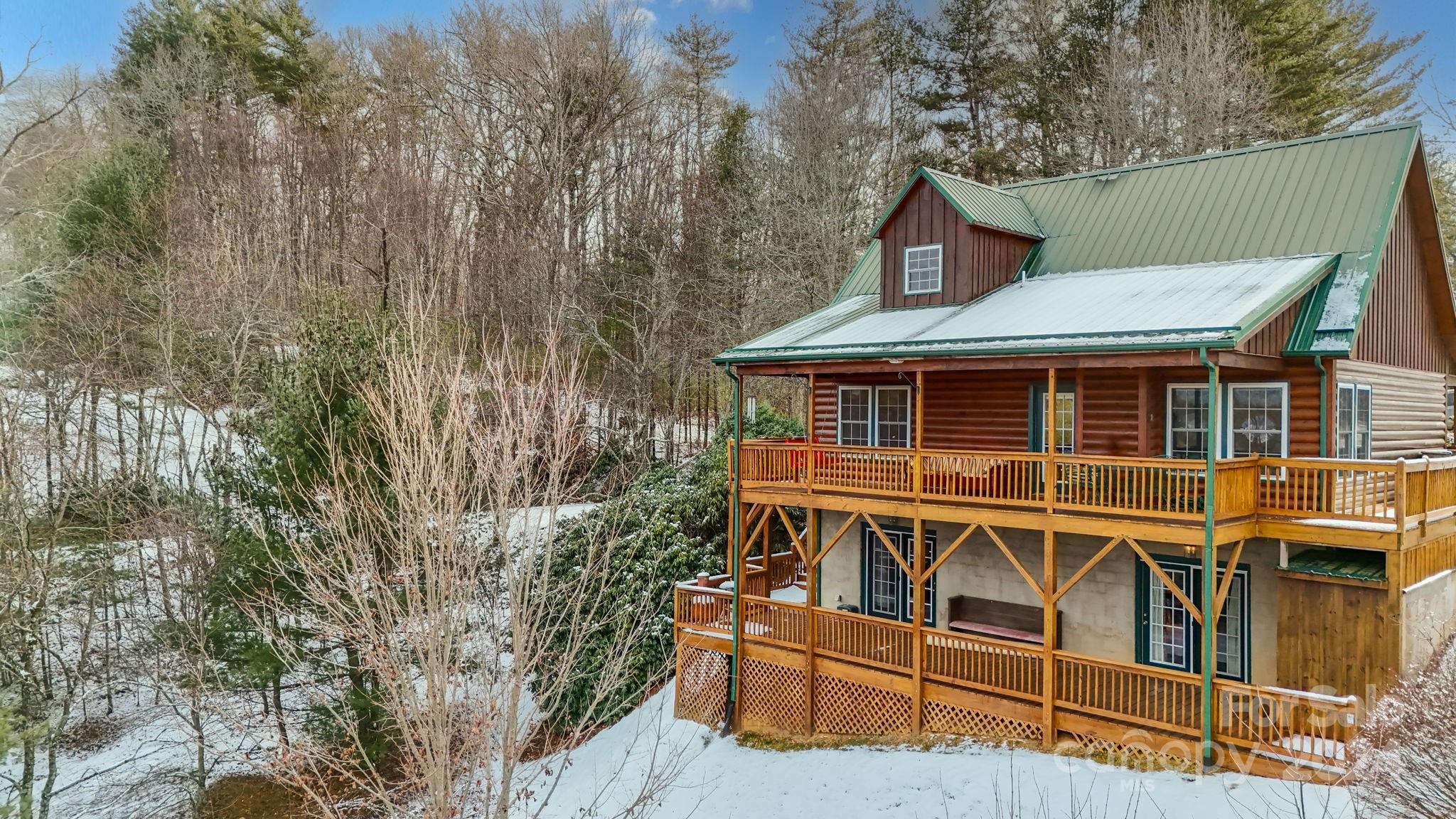 a view of a house with wooden fence