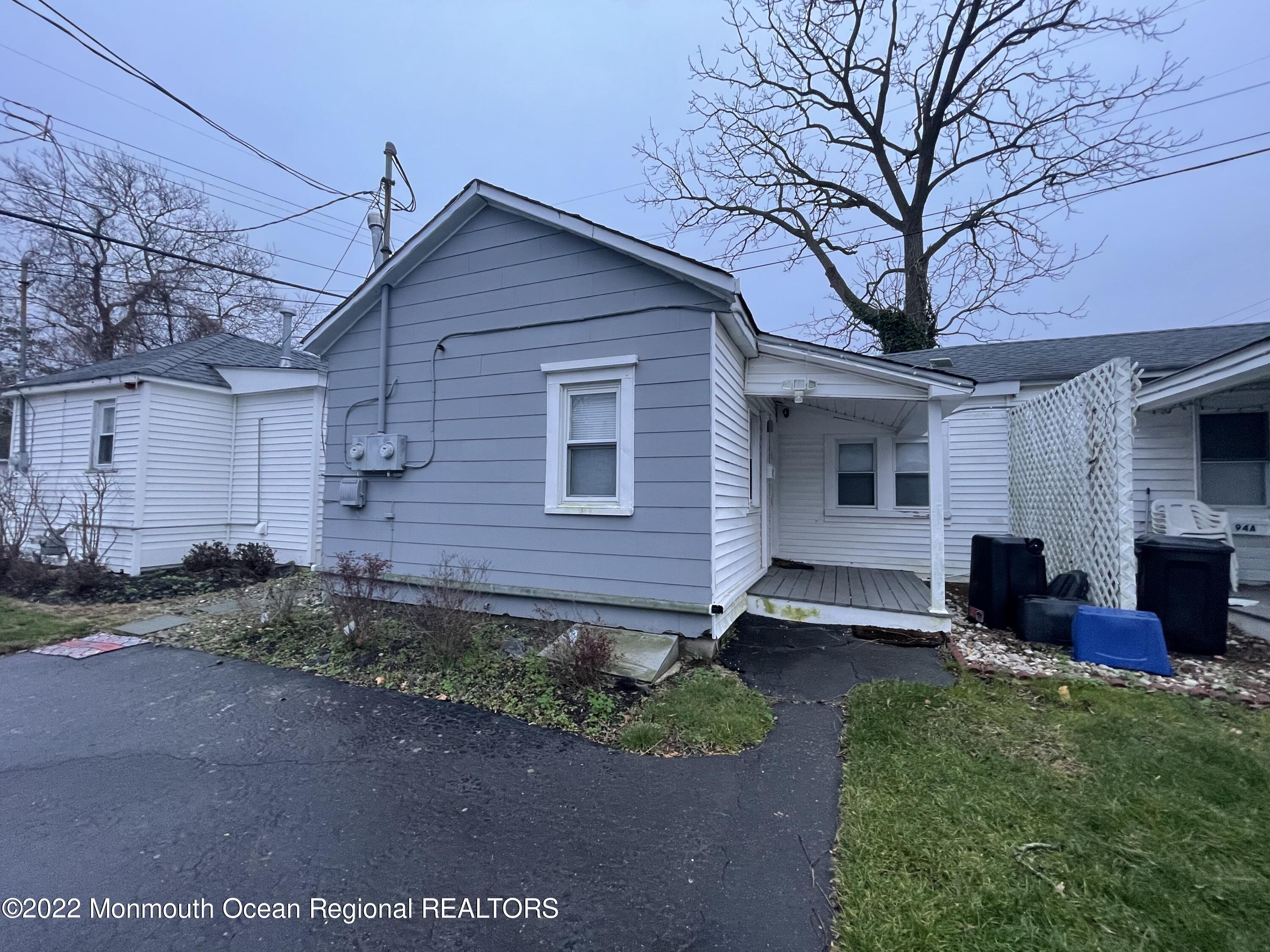 a front view of house with yard and seating space