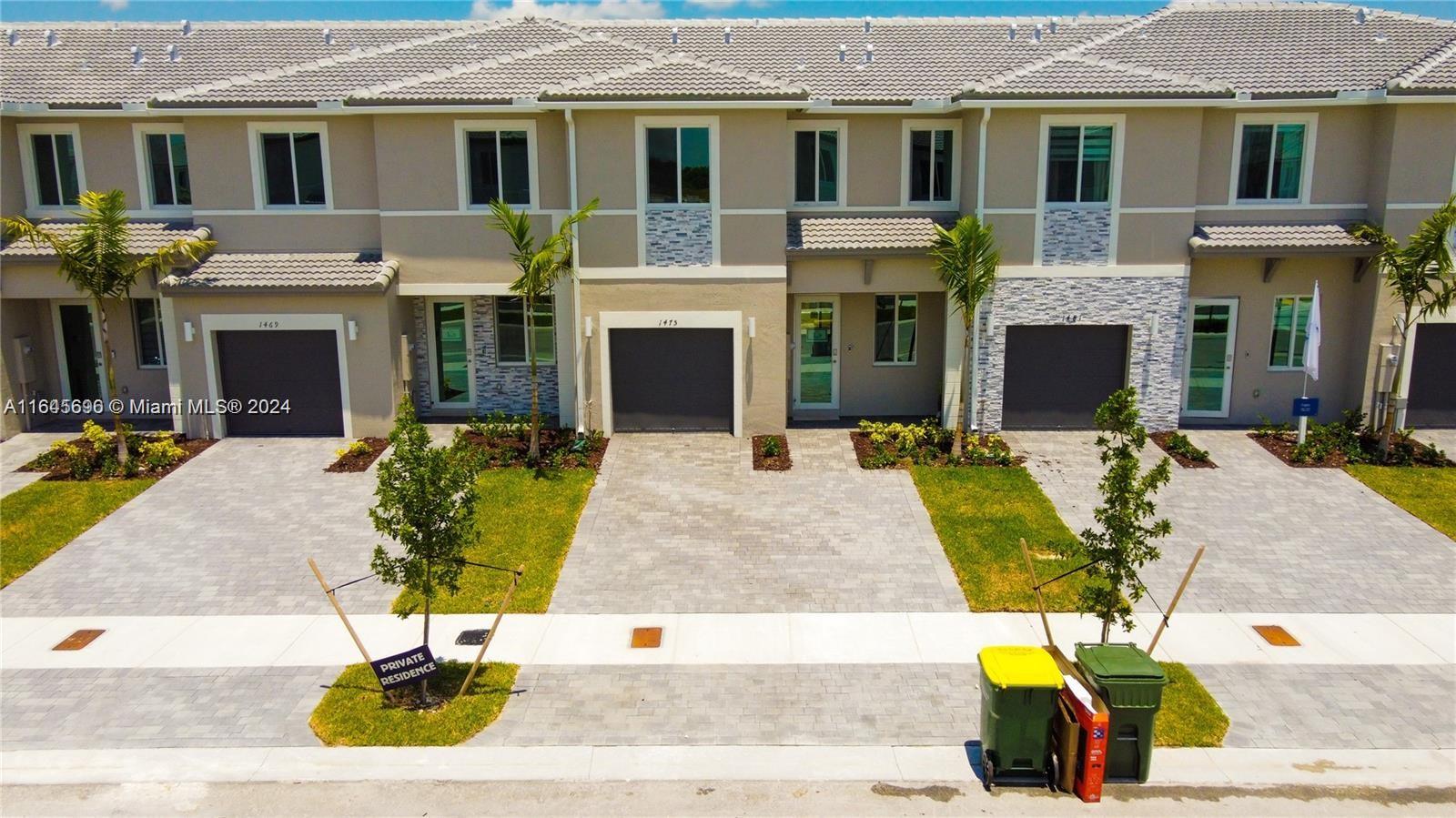 a view of a house with outdoor seating space