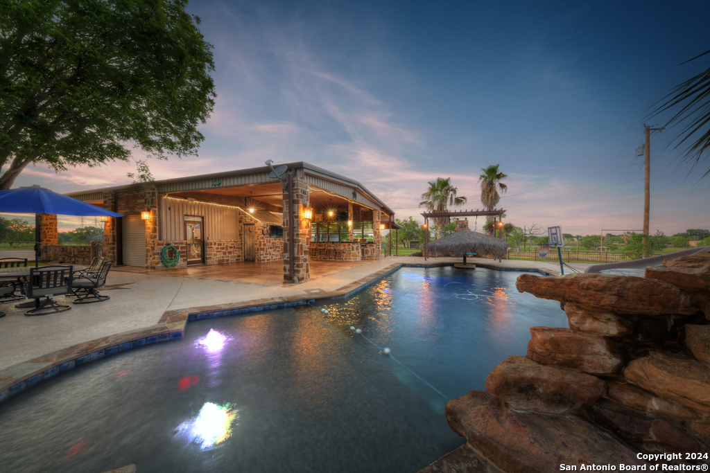 a view of a swimming pool with sitting area