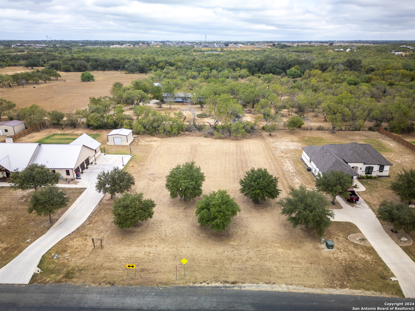 an aerial view of a house with a lake view