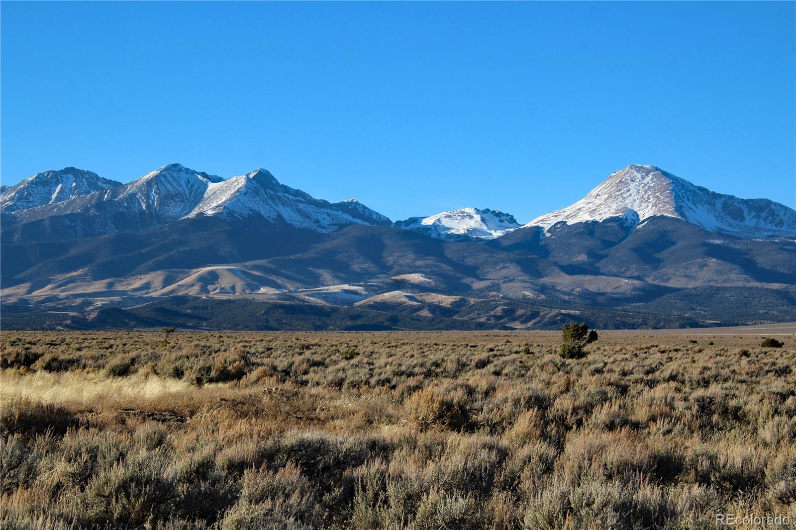 a view of a large building with a mountain in the background