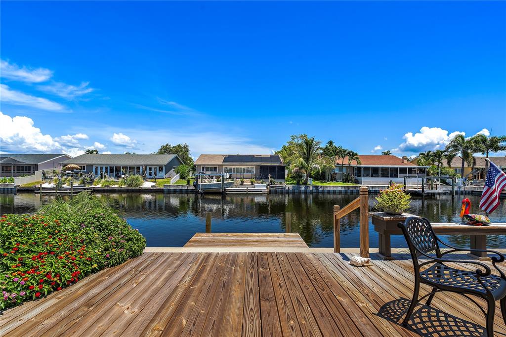 a view of a lake with outdoor seating