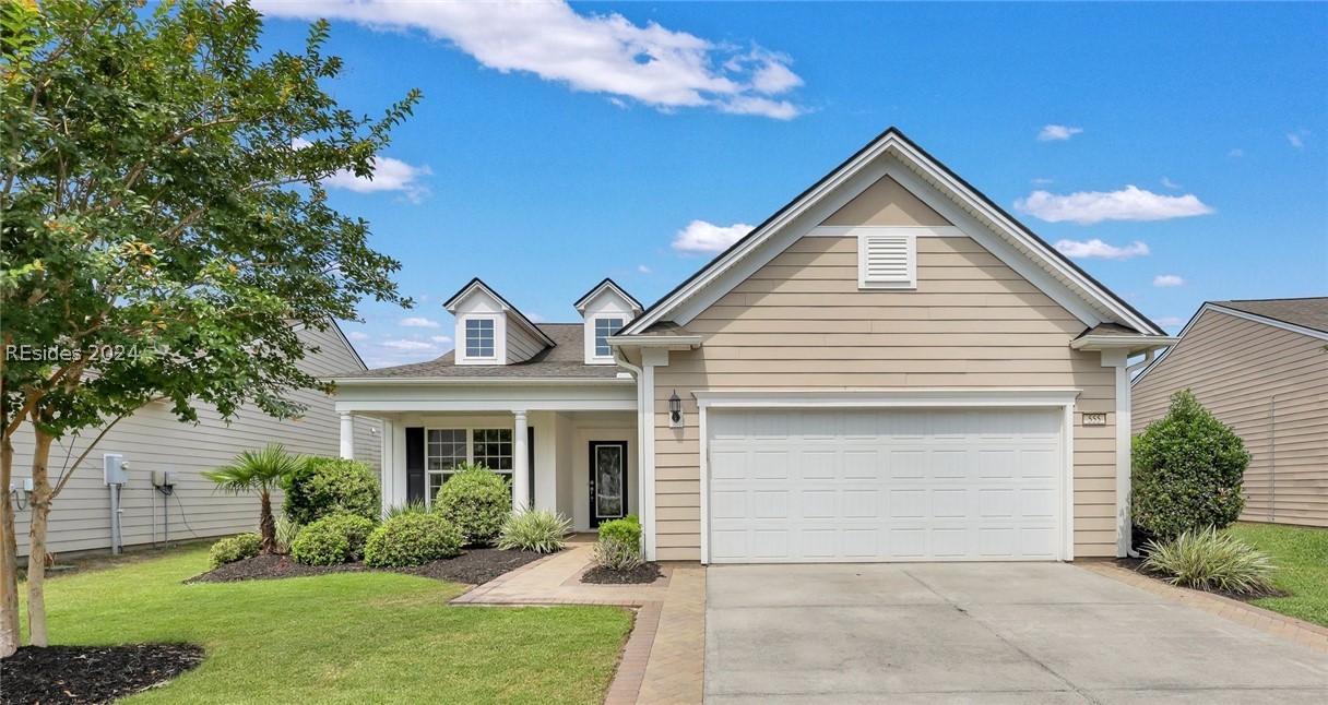 Two car garage and front porch has with pavers