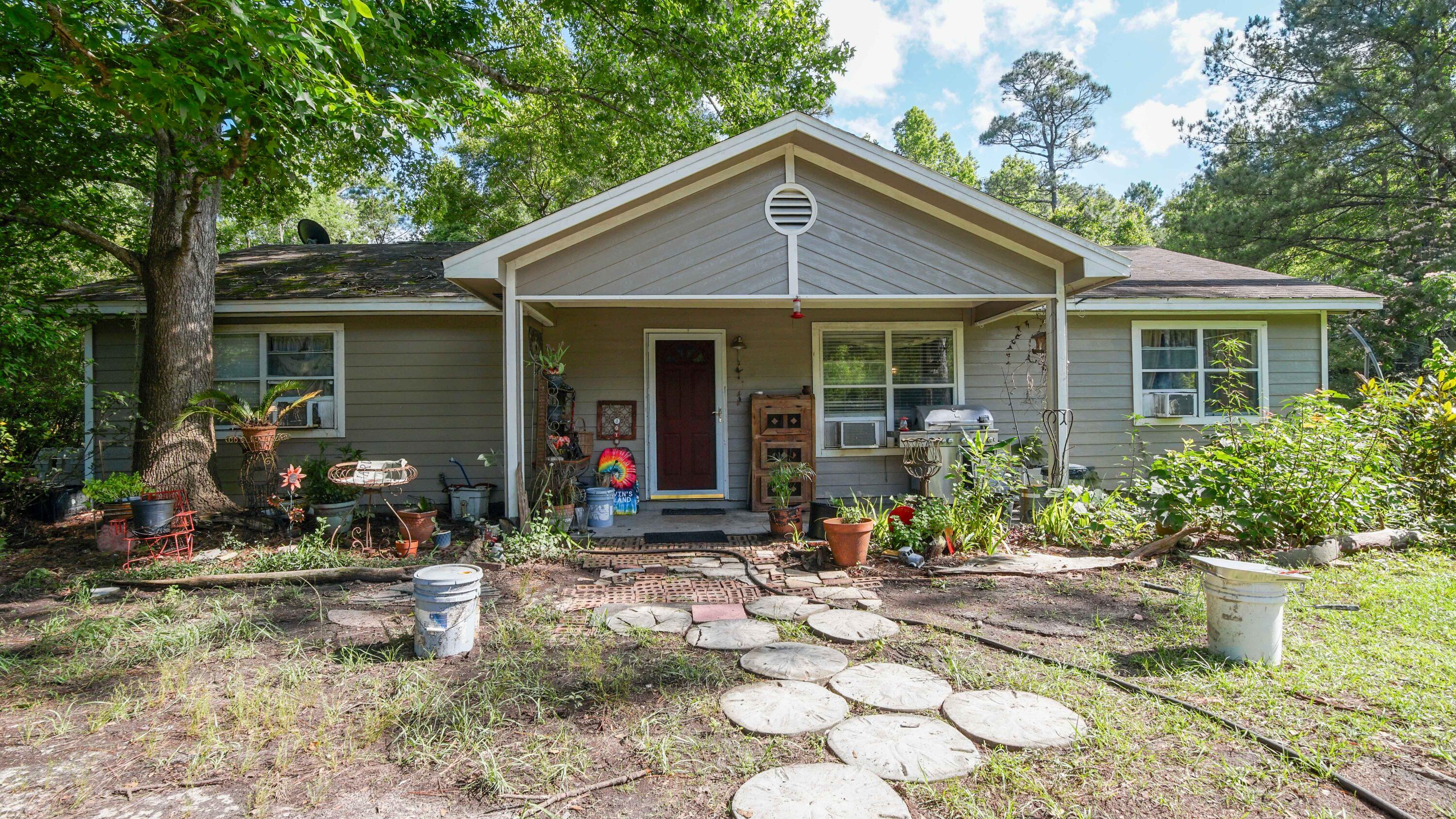 a front view of a house with garden