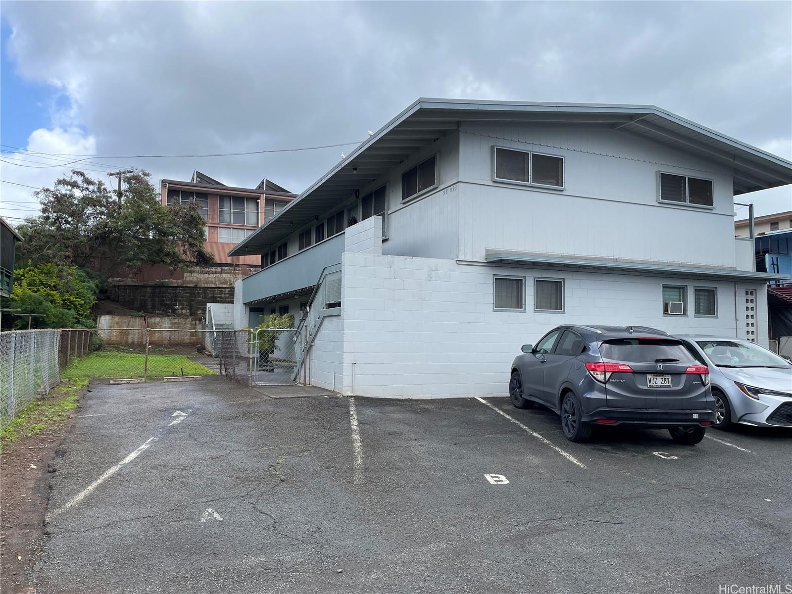 a view of a car parked in front of a house