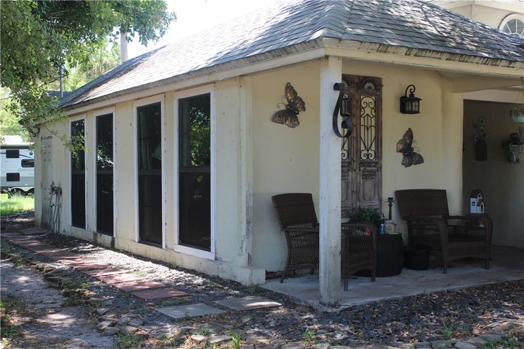 a backyard of a house with seating space